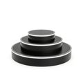 Stack of black circular objects isolated on white background Royalty Free Stock Photo