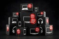 Stack of black electronics boxes with white device icons and red discount stickers Royalty Free Stock Photo