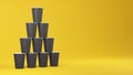 Stack of black paper coffee cups standing on each other in the shape of a pyramid. 3d rendered layout.