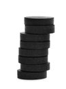 Stack of black pills on white background Royalty Free Stock Photo