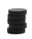 Stack of black pills on white background. Royalty Free Stock Photo