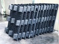 Stack of black plastic boxes in warehouse, ready for shipment to customers. Royalty Free Stock Photo