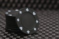A stack of black poker chips Royalty Free Stock Photo