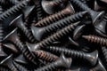 Stack of black stainless steel screw, equipment construction