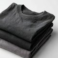A stack of black t-shirts sitting on top of each other Royalty Free Stock Photo