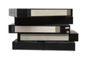 A stack of black VHS video tapes with blank labels on a white back Royalty Free Stock Photo