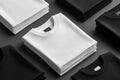 Stack of black and white folded clothes on dark background. mockup Royalty Free Stock Photo