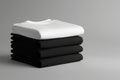Stack of black and white folded clothes on white background. mockup Royalty Free Stock Photo
