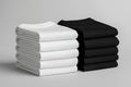 Stack of black and white folded clothes on white background. mockup Royalty Free Stock Photo