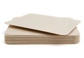 A stack of blank, beige-colored, recycled paper sheets on a white background Royalty Free Stock Photo