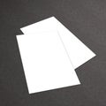 Stack of blank business card on white textured background Royalty Free Stock Photo