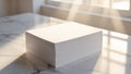 A stack of blank paper sheets resting on a marble table with sunlight filtering through the window Royalty Free Stock Photo