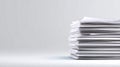 Stack of blank sheets of paper against a minimalist gray background suitable for contemporary corporate presentation and web Royalty Free Stock Photo