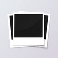 Stack of blank vintage paper photo frames from instant camera with shadow