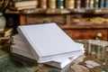 Stack of Blank White Books on Elegant Wooden Desk with Vintage Library Background, Copy Space for Education and Literature Concept Royalty Free Stock Photo