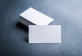 Blank white business card on grey background top view. Royalty Free Stock Photo