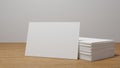 Stack of blank white business card, namecard mockup on wood table, promote company brand, 3D rendering