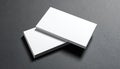 Stack of Blank White Business Cards on Dark Textured Surface pile Royalty Free Stock Photo