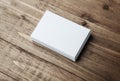 Stack of blank white business cards on wooden background Royalty Free Stock Photo