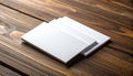 Stack of blank white cards overlapping on a dark brown wooden table surface image photo Royalty Free Stock Photo