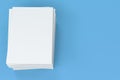 Stack of blank white closed brochure mock-up on blue background Royalty Free Stock Photo
