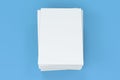 Stack of blank white closed brochure mock-up on blue background Royalty Free Stock Photo