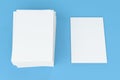 Stack of blank white closed brochure mock-up on blue background Royalty Free Stock Photo