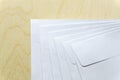 Blank white envelopes on wooden desk