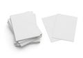 Stack of blank white paper sheets on a clean white background with two separate sheets Royalty Free Stock Photo