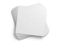 Stack of blank white paper sheets on a plain white background with soft shadows Royalty Free Stock Photo
