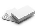 A stack of blank white paper sheets on top of a gray textured surface Royalty Free Stock Photo