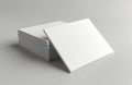 Stack of blank white square cards on gray background. Ready for your unique design, business card, or invitation project. Royalty Free Stock Photo