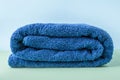 Stack of blue clean bath towels, beauty and massage spa Royalty Free Stock Photo