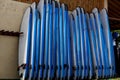 Stack of blue color soft surfboards