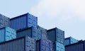 Stack of blue container boxes with sky background. Cargo freight shipping for import and export logistics. Business and Royalty Free Stock Photo