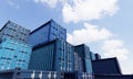 Stack of blue container boxes with sky background. Cargo freight shipping for import and export logistics. Business and Royalty Free Stock Photo