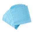 Stack of blue dotted paper napkins isolated on white