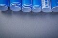 Stack of blue engineering drawings on grey background copy space Royalty Free Stock Photo