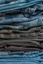 Stack of blue and gray old jeans. Closeup Royalty Free Stock Photo