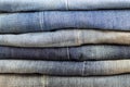 stack of blue jeans with different color characters Royalty Free Stock Photo