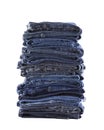 Stack of blue jeans isolated on white background Royalty Free Stock Photo