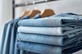 A stack of blue jeans on a rack in a clothing store Royalty Free Stock Photo
