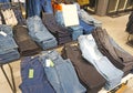 Stack of blue jeans in a shop Royalty Free Stock Photo
