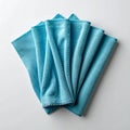 Stack of Blue Microfiber Cleaning Cloths Spread Out On White Background Royalty Free Stock Photo