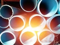 Stack of blue pvc pipes with sunbeam Royalty Free Stock Photo