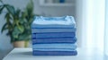 Stack of blue shirts on a table Royalty Free Stock Photo