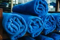 Stack of blue towels rolled up