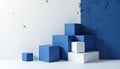 Stack of blue, white cubes against wall. Abstract composition features geometric shapes, minimalistic modern design, creative Royalty Free Stock Photo