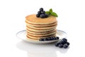 Stack of blueberry pancakes with mint on white Royalty Free Stock Photo