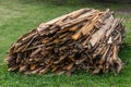 Stack of boards wound with steel wire on grass